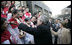 President George W. Bush reaches out to church members Sunday, Nov. 20, 2005, at the Gangwashi Church in Beijing after he and Mrs. Bush attended services.