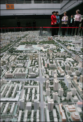 A model of the future Beijing sits in the foreground as Mrs. Bush and Sarah Randt, wife of the U.S. Ambassador to China, tour the Beijing Urban Planning Museum Sunday, Nov. 20, 2005, in Beijing