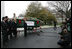 Laura Bush welcomes the arrival of the official White House Christmas tree delivered, Monday, Nov. 28, 2005, on a horse drawn wagon. This year's tree, donated by the Deal Family of Smokey Holler Tree Farm in Laurel Springs, N.C., is the 40th year the National Christmas Tree Growers Association has provided a tree to the White House.