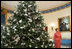 Laura Bush stands next to the Blue Room Christmas tree, Wednesday, Nov. 30, 2005, as she answers questions during the press preview of the White House Christmas decorations.