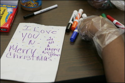 A personal note is written on a sandwich bag by a student Wednesday, Nov. 30, 2005 during a visit to the Church of the Epiphany in Washington by Mrs. Laura Bush, as part of her Helping America's Youth initiative. The students, part of the Youth Service Learning Project, were preparing sandwiches for the homeless.