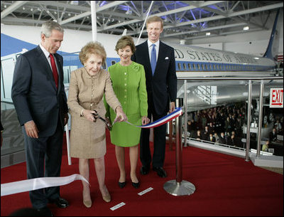 President George W. Bush and Laura Bush join Nancy Reagan, Friday, Oct. 21, 2005, as she cuts the ribbon to officially open the Air Force One Pavilion at the Ronald Reagan Library in Simi Valley, Calif., featuring the Boeing 707 aircraft that served President Ronald Reagan and six other presidents. Fred Ryan Jr. of the Ronald Reagan Presidential Foundation is seen at right.