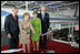 President George W. Bush and Laura Bush join Nancy Reagan, Friday, Oct. 21, 2005, as she cuts the ribbon to officially open the Air Force One Pavilion at the Ronald Reagan Library in Simi Valley, Calif., featuring the Boeing 707 aircraft that served President Ronald Reagan and six other presidents. Fred Ryan Jr. of the Ronald Reagan Presidential Foundation is seen at right.