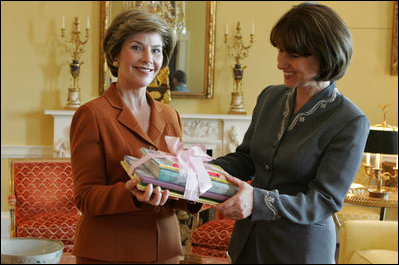 Laura Bush presents Mrs. Zorka Parvanova, First Lady of the Republic of Bulgaria, Monday, October 17, 2005, with signed children's books for the shelves of Sofia City Public Library in Sofia City, Bulgaria.