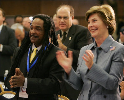 Laura Bush and Louie Culver give Culver's daughter, Sarah Tucker, a standing ovation at the completion of her award winning essay, Thursday, Oct. 27, 2005 at Howard University in Washington, at the White House Conference on Helping America's Youth.