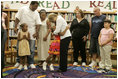 Laura Bush embraces a child Thursday, Sept. 8, 2005 of one of the families from New Orleans, displaced last week as a result of Hurricane Katrina, during a meeting at the Greenbrook Elementary School in DeSoto County, Miss. Greenbrook Elementary School has enrolled the most displaced students among the DeSoto County schools in Mississippi.