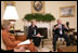 President George W. Bush, seen with U.S. Secretary of Education Margaret Spellings, center, and Laura Bush, left, gestures as he speaks with reporters, Tuesday, Sept. 6, 2005 in the Oval Office at the White House, about efforts the Department of Education is undertaking with a program, "Hurricane Help for Schools," established to assist schools and students affected by Hurricane Katrina.