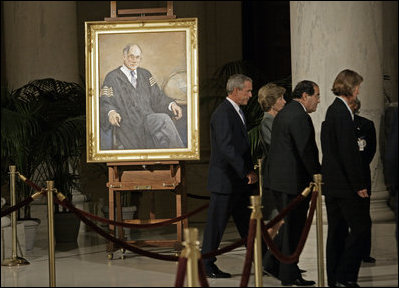 President George W. Bush and Laura Bush walk with Justice Antonin Scalia and Sally Rider, the Chief Justice's assistant, after viewing a portrait of Chief Justice William Rehnquist as his body lies in repose in the Great Hall of the U.S. Supreme Court Tuesday, Sept. 6, 2005.