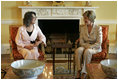 Laura Bush visits with Mrs. Hero Ibrahim Ahmed, wife of Iraqi President Jalal Talabani, during a tea in the private residence of the White House Monday, Sept. 12, 2005.