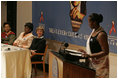 Laura Bush listens to Jeannette Kagame, the First Lady of Rwanda and President of the Organization of African First Ladies Against HIV/AIDS, addresses the group in New York Thursday, Sept. 15, 2005.