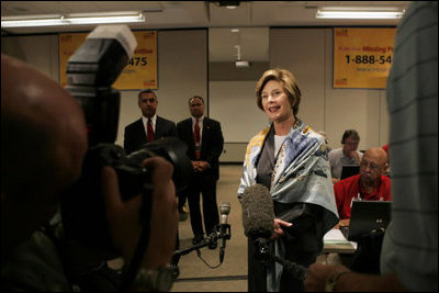 Laura Bush talks with the press during her visit to the National Center for Missing & Exploited Children in Alexandria, Va., Friday, Sept. 16, 2005.