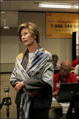 Laura Bush talks with the press during her visit to the National Center for Missing & Exploited Children in Alexandria, Va., Friday, Sept. 16, 2005.