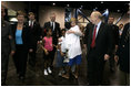 Laura Bush is greeted by three youngsters upon her arrival Monday, Sept. 19, 2005, to "Operation Compassion" at George R. Brown Convention Center in Houston.