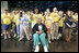 "Operation Compassion" volunteers wave to First Lady Laura Bush Monday, Sept. 19, 2005, as she visited Houston's George R. Brown Convention Center. The Convention Center was designated a shelter for Hurricane Katrina evacuees and since opening its doors Sept. 2, more than 35,000 have been served and approximately 46,000 volunteers have been trained.