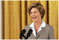 Laura Bush speaks at the National Book Festival Author's breakfast in the East Room, Saturday, Sept. 24, 2005. "Great books have brought many people through difficult times," said Mrs. Bush, explaining that the Book Festival is collecting books for schools, libraries and those affected by the recent hurricanes. "A story's setting -- real or imagined -- can provide a much-needed escape. And the characters in a good book are like old friends by the time we turn the final page."