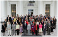 Laura Bush stands with guests of the National Book Festival Author's breakfast on the North Portico of the White House Saturday, Sept. 24, 2005.