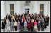 Laura Bush stands with guests of the National Book Festival Author's breakfast on the North Portico of the White House Saturday, Sept. 24, 2005.