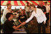 Laura Bush meets with people while visiting a medical and food distribution site, Tuesday, Sept. 27, 2005 in Biloxi, Miss.