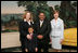 Mrs. Laura Bush poses for a photo with Sal Tinajero, his wife Jennifer and son Salvador, Thursday, April 6, 2006, in the Diplomatic Room at the White House. Mr. Tinajero, a high school teacher in Santa Ana, CA, is the recipient of Hispanic Magazine's Teacher of the Year award, which recognizes him as a single outstanding educator within the Hispanic community by means of motivating, inspiring and preparing his students for a promising future.