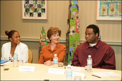 Mrs. Laura Bush listens to Jeremy Greathouse, an unemployed New Orleans youth, and LaToya Dorsha Williams, an Urban League participant, about difficulties of life experiences and employment during a discussion with the National Urban League in New Orleans, La., Monday, April 10, 2006. Urban League affiliate sites are providing youth care-focused employability skills, paid internships, and on-the job training to help participants enter full-time, private sector employment.