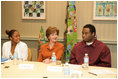 Mrs. Laura Bush listens to Jeremy Greathouse, an unemployed New Orleans youth, and LaToya Dorsha Williams, an Urban League participant, about difficulties of life experiences and employment during a discussion with the National Urban League in New Orleans, La., Monday, April 10, 2006. Urban League affiliate sites are providing youth care-focused employability skills, paid internships, and on-the job training to help participants enter full-time, private sector employment.