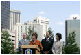 Mrs. Laura Bush, flanked by Mark Sanders, GM of Marriott Hotels, Marc Morial, President and CEO of the National Urban League, and Labor Secretary Elaine Chao, announces a $20 million dollar grant to the National Urban League in New Orleans, La., Monday, April 10, 2006, for their Youth Empowerment program to help at-risk youth find stable employment, as part of the Helping America's Youth initiative.