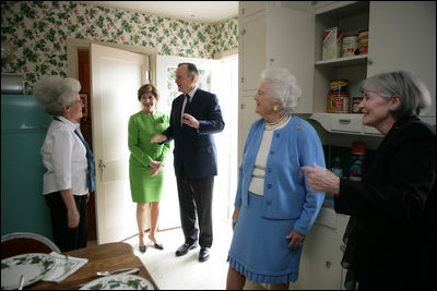 Gayle Dodson, Docent Coordinator, Left, and Dealey Herndon, Restoration/Historian greet Laura Bush, former President George H.W. Bush, and Mrs. Barbara Bush, Tuesday, April 11, 2006, at the beginning of their tour of George W. Bush Childhood Home in Midland, Texas.