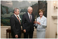 Victor Mooney, American Egg Board Chairman and Louis Raffel, American Egg Board President, present Mrs. Laura Bush with an annual commemorative egg from the American Egg Board Thursday, April 6, 2006 at the White House. The egg shell has been carved to display the Presidential Seal.