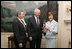 Victor Mooney, American Egg Board Chairman and Louis Raffel, American Egg Board President, present Mrs. Laura Bush with an annual commemorative egg from the American Egg Board Thursday, April 6, 2006 at the White House. The egg shell has been carved to display the Presidential Seal.