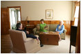 Mrs. Laura Bush, Mrs. Barbara Bush, and former President George H.W. Bush share a moment in the living room of President George W. Bush's Childhood Home in Midland, Texas, on Tuesday, April 11, 2006, prior to a dedication and ribbon cutting ceremony of the home.