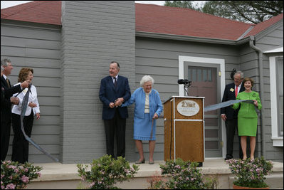 Former President George H.W. Bush and Mrs. Barbara Bush share a laugh with Mrs. Laura Bush and Midland friends, George Scott, Jan O'Neill, and Joe O'Neill, after cutting the ribbon on Tuesday, April 11, 2006, at the dedication of the President George W. Bush's Childhood Home in Midland, Texas.