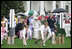 Mrs. Laura Bush and President George W. Bush welcome guests to the 2006 White House Easter Egg Roll, Monday, April 17, 2006, a tradition on the South Lawn of the White House since 1878.