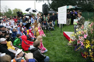 Mrs. Laura Bush reads a story to children attending the 2006 White House Easter Egg Roll, Monday, April 17, 2006 on the South Lawn of the White House.