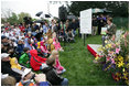 Mrs. Laura Bush reads a story to children attending the 2006 White House Easter Egg Roll, Monday, April 17, 2006 on the South Lawn of the White House.