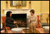 Mrs. Laura Bush visits with Mrs. Hoda Siniora, wife of Lebanon Prime Minister Fouad Siniora, during a tea in the Yellow Oval Room of the White House, Tuesday, April 18, 2006.