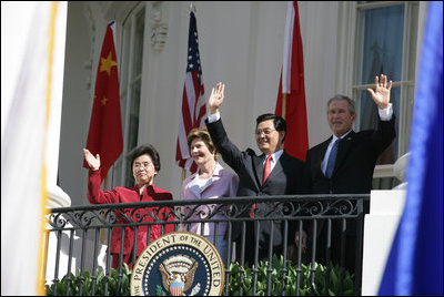 President George W. Bush, Chinese President Hu Jintao, Laura Bush and Hu's wife, Liu Yongqing, wave from the South Portico balcony after the South Lawn Arrival Ceremony at the White House, Thursday, April 20, 2006.