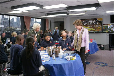 On a visit to Charlestown Navy Yard in Boston, Mass., during National Park Week, Mrs. Laura Bush and students from Warren-Prescott School, participate in an electronic field trip to Carlsbad Caverns National Park, N.M., Tuesday, April 24, 2006. Electronic field trips allow students to virtually visit, via the internet, US National Parks and are made possible through partnerships between Ball State University and museums across the country.