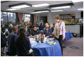 On a visit to Charlestown Navy Yard in Boston, Mass., during National Park Week, Mrs. Laura Bush and students from Warren-Prescott School, participate in an electronic field trip to Carlsbad Caverns National Park, N.M., Tuesday, April 24, 2006. Electronic field trips allow students to virtually visit, via the internet, US National Parks and are made possible through partnerships between Ball State University and museums across the country.