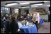 On a visit to Charlestown Navy Yard in Boston, Mass., during National Park Week, Mrs. Laura Bush and students from Warren-Prescott School, participate in an electronic field trip to Carlsbad Caverns National Park, N.M., Tuesday, April 24, 2006. Electronic field trips allow students to virtually visit, via the internet, US National Parks and are made possible through partnerships between Ball State University and museums across the country.