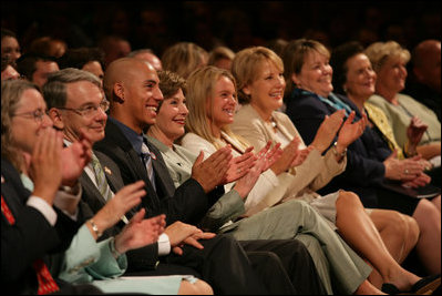 Mrs. Laura Bush, joined by, from left, Robert D. Coombe, Ph.D., Chancellor, University of Denver, Jordan Suniga, Student, Grace Keirnes, Student, and Lt. Governor Jane E. Norton, Lt. Governor of Colorado, attends the second regional Helping America's Youth Conference on Friday, August 4, 2006, in Denver, Colorado. According to the Department of Defense there are approximately 189, 000 children of deployed parents nationwide.