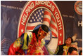 A member of The Seven Falls Indian Dancers performs during the second regional Helping America's Youth Conference on Friday, August 4, 2006, in Denver, Colorado. The dancers are from the Pawnee, Flandreau Santee-Sioux Crow Creek Sioux, and Cheyenne River Sioux tribes. The troupe has been dancing throughout Colorado for over 25 years.