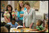 Mrs. Laura Bush meets and speaks with members of the Gorenflo Elementary School first grade class and their faculty Monday, Aug. 28, 2006, at their temporary portable classroom at the Beauvoir Elementary School in Biloxi, Miss. The students, whose school was damaged by Hurricane Katrina, are sharing the facilities of the Beauvoir school until their school's renovations are complete.