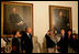 President George W. Bush and Laura Bush watch as Ariel Cohen, 14, lights the Menorah on the fourth night of Hanukkah during the annual White House Hanukkah reception Monday, Dec. 18, 2006. Pictured at right are Ariel's parents, Dan and Rachel Cohen, and sister Alison, 11.