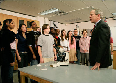 President George W. Bush speaks with science and engineering students after touring the Yvonne A. Ewell Townview Magnet Center in Dallas, Texas, Friday, Feb. 3, 2006.