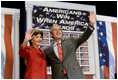 President George W. Bush and Mrs. Bush wave to the audience following the President's remarks on the 2006 agenda, Wednesday, Feb. 1, 2006 at the Grand Ole Opry House in Nashville.