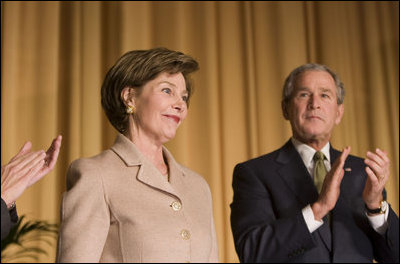 Mrs. Laura Bush acknowledges applause from President George W. Bush and the audience Thursday, Feb. 2, 2006, as she's introduced during the National Prayer Breakfast at the Hilton Washington Hotel.