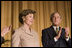 Mrs. Laura Bush acknowledges applause from President George W. Bush and the audience Thursday, Feb. 2, 2006, as she's introduced during the National Prayer Breakfast at the Hilton Washington Hotel.