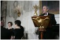 President George W. Bush addresses guests Monday evening, Feb. 6, 2006 in the State Dining Room at the White House to honor The Dance Theatre of Harlem.