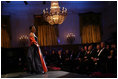 President George W. Bush and Laura Bush listen to soprano Harolyn Blackwell perform in the East Room of the White House during a dinner in honor of The Dance Theatre of Harlem Monday, February 6, 2006.