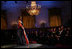 President George W. Bush and Laura Bush listen to soprano Harolyn Blackwell perform in the East Room of the White House during a dinner in honor of The Dance Theatre of Harlem Monday, February 6, 2006.